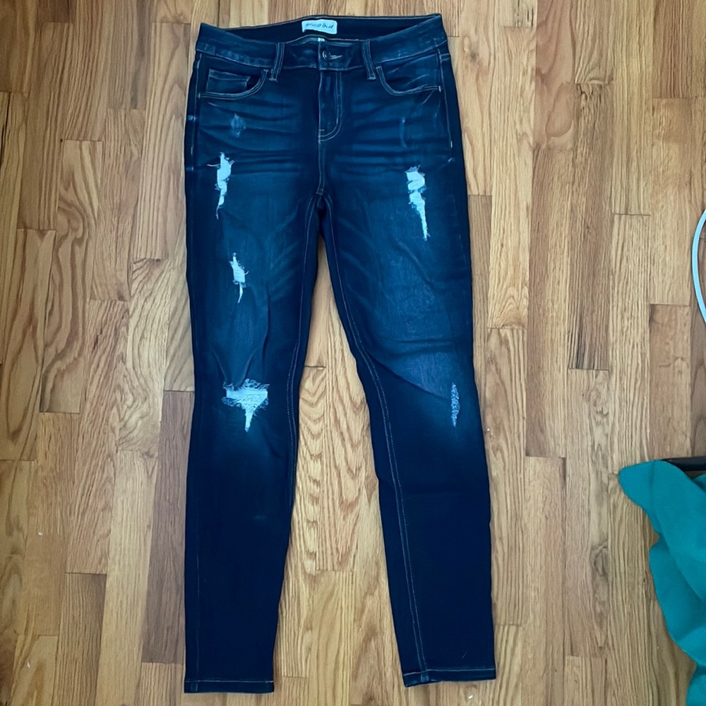 Dark wash distressed high rise skinny jeans